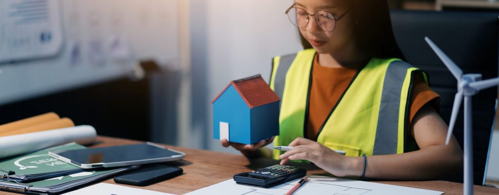 Female architect working at home She looked at the blueprint.